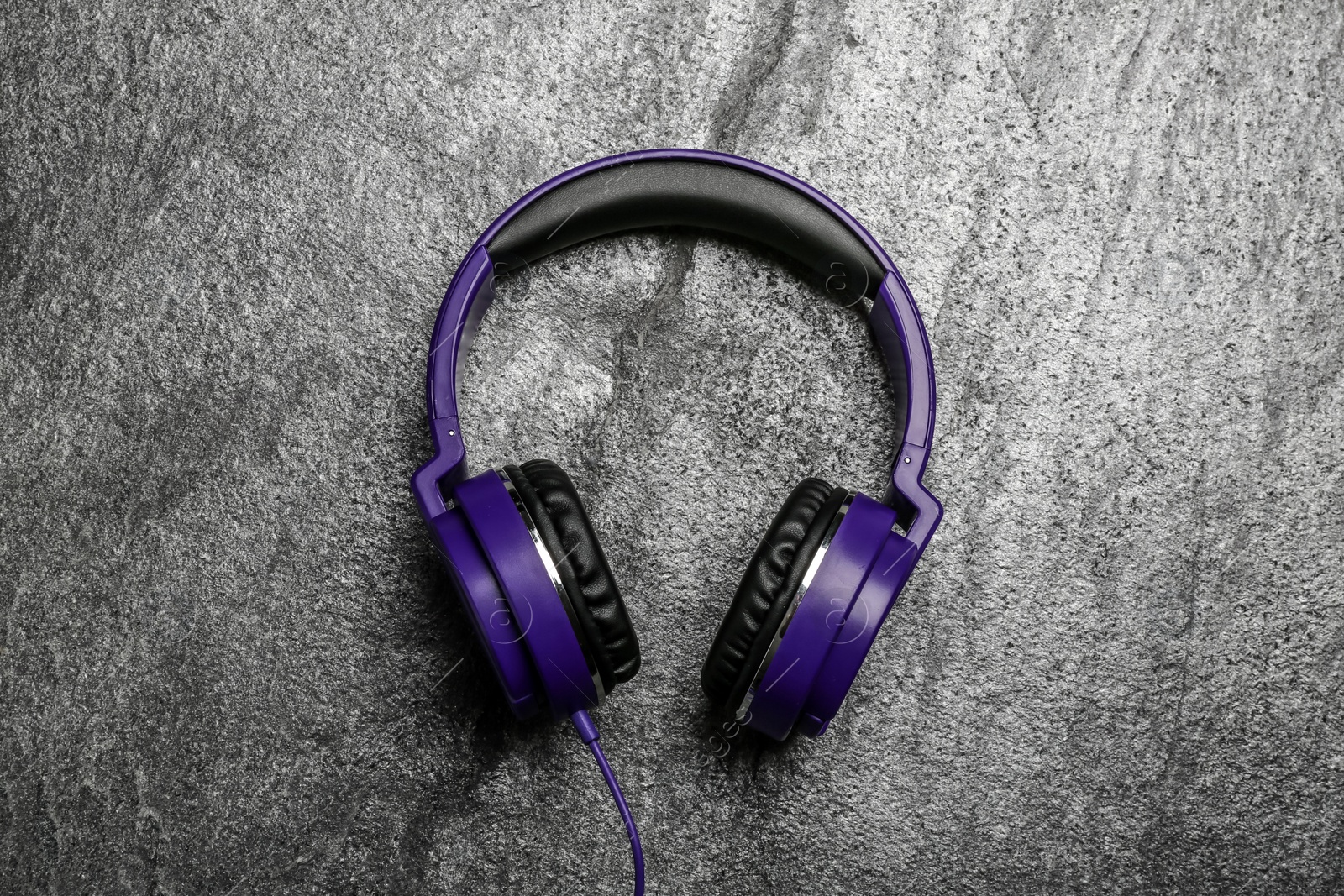 Photo of Stylish headphones on grey background, top view