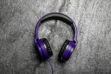 Stylish headphones on grey background, top view