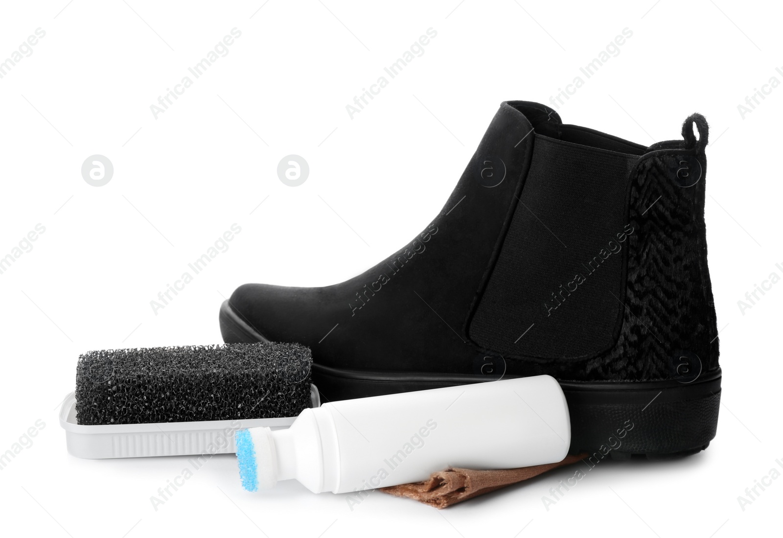 Photo of Stylish footwear with shoe care accessories on white background