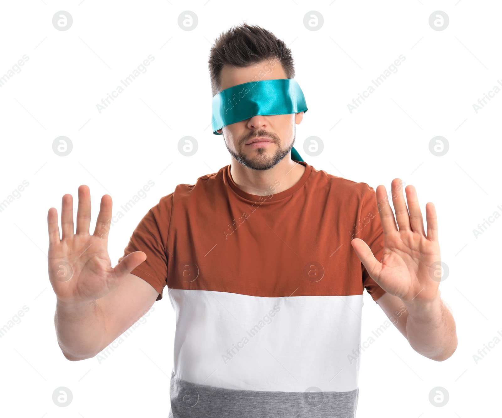 Photo of Man with light blue blindfold on white background