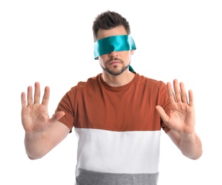 Man with light blue blindfold on white background