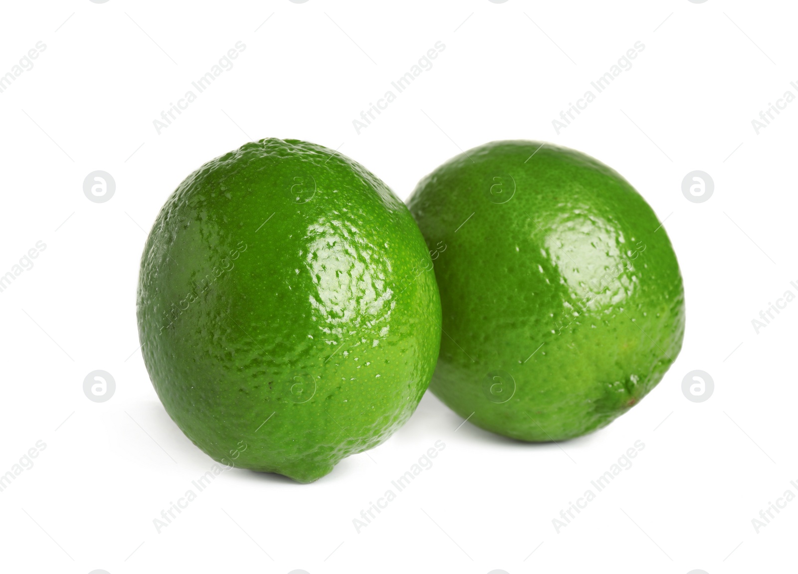 Photo of Fresh green ripe limes isolated on white