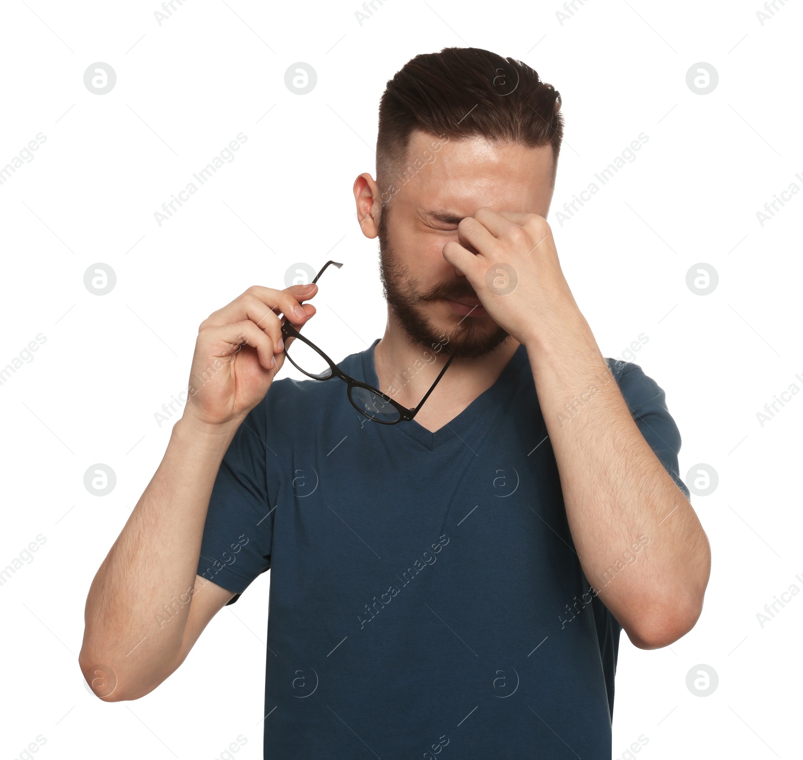 Photo of Young man suffering from eyestrain on white background