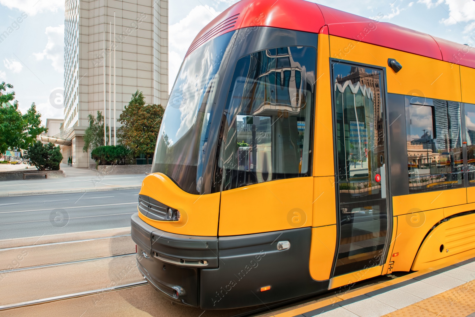 Photo of Streetcar on road in city. Public transport