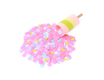 Photo of Colorful confetti with bright party cracker isolated on white, above view
