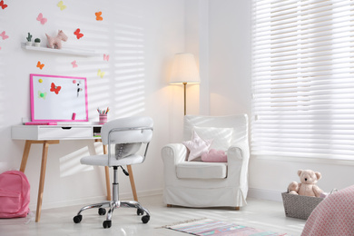 Photo of Modern child room interior with stylish furniture