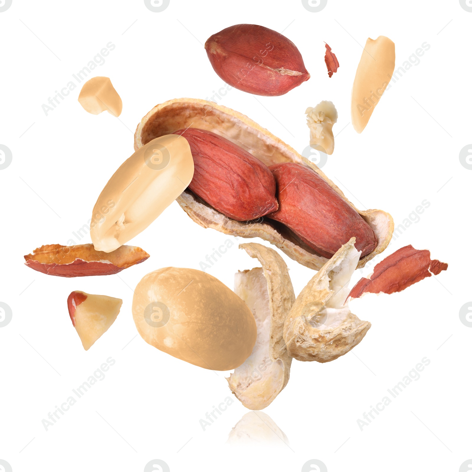 Image of Peanuts and crushed pod in air on white background