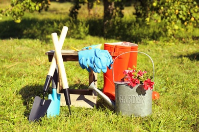 Set of gardening tools on grass outdoors