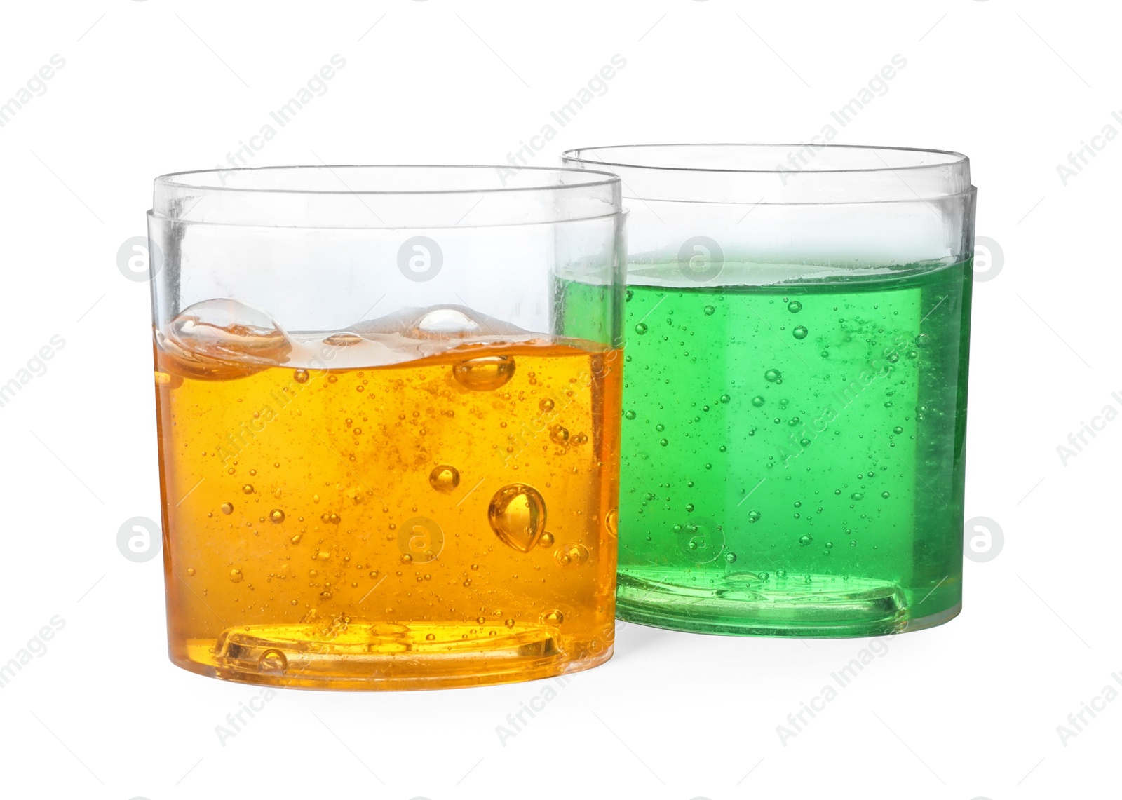 Photo of Colorful slimes in plastic containers isolated on white. Antistress toy