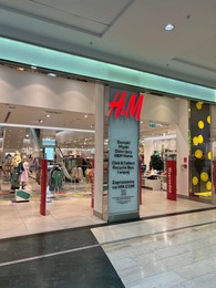 Photo of Poland, Warsaw - July 12, 2022: Official H&M store in shopping mall