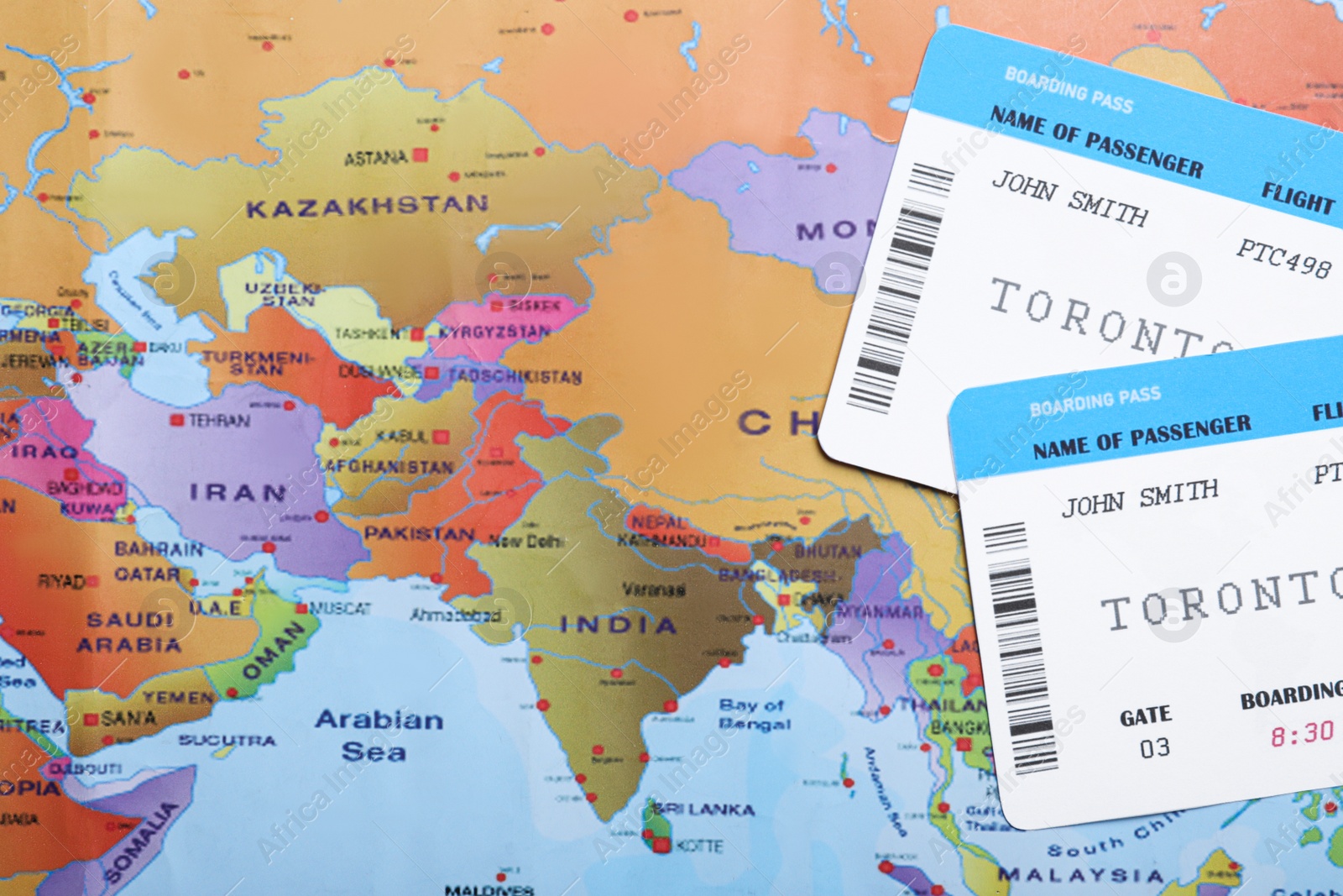 Photo of Avia tickets on world map, flat lay. Travel agency concept