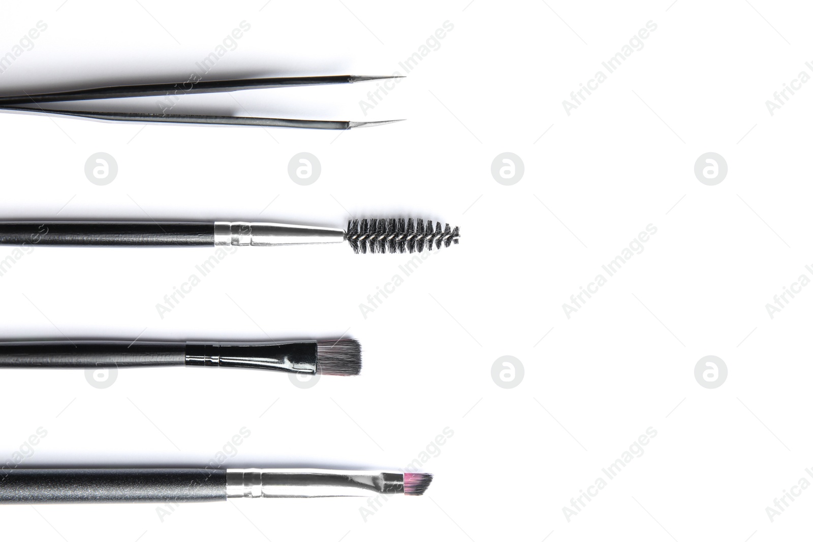 Photo of Set of professional eyebrow tools on white background, top view