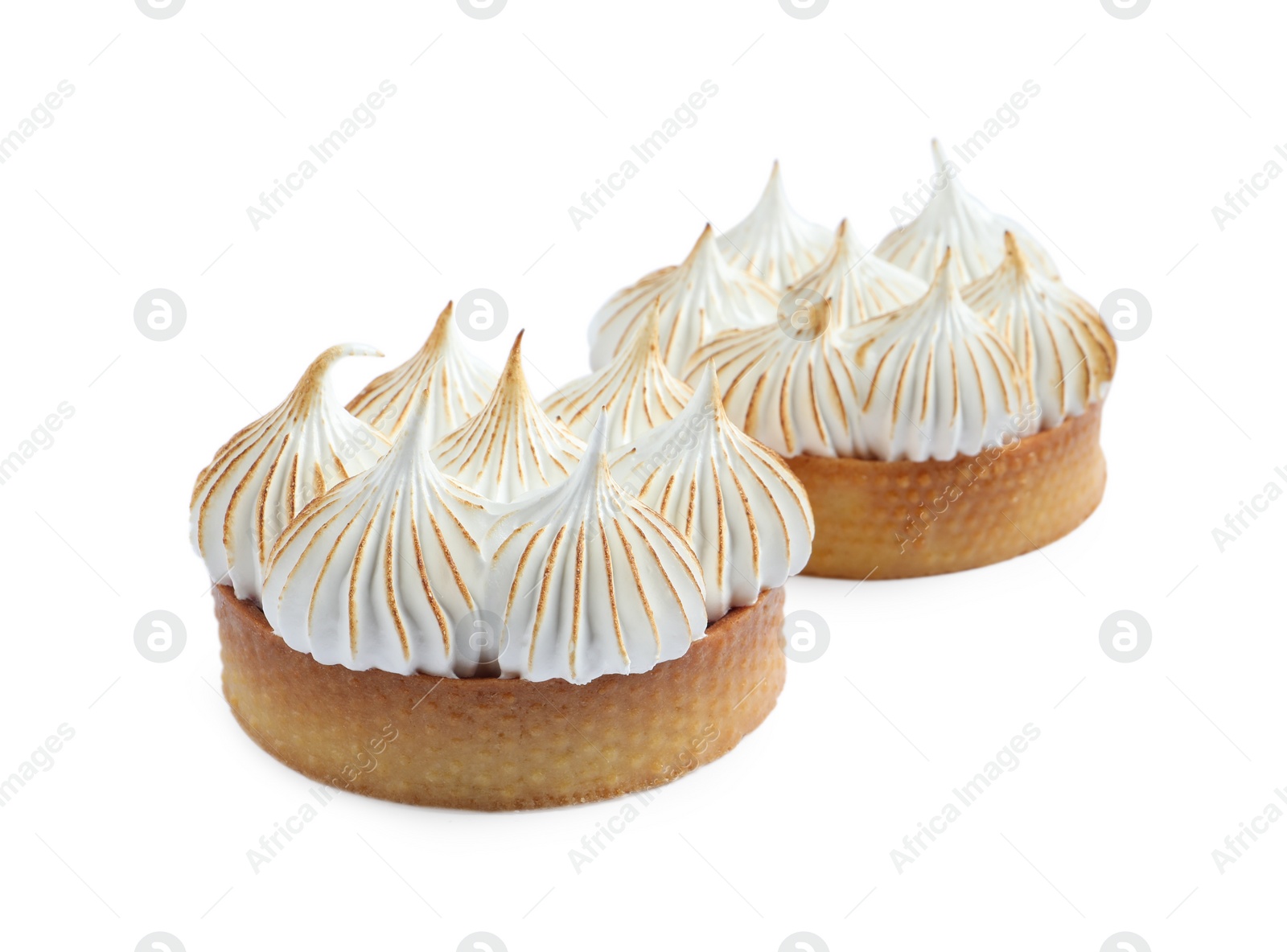 Photo of Tartlets with meringue isolated on white. Tasty dessert