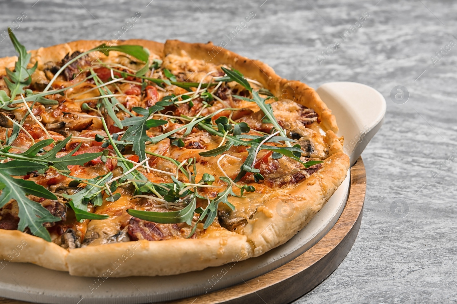 Photo of Tasty fresh homemade pizza on grey background