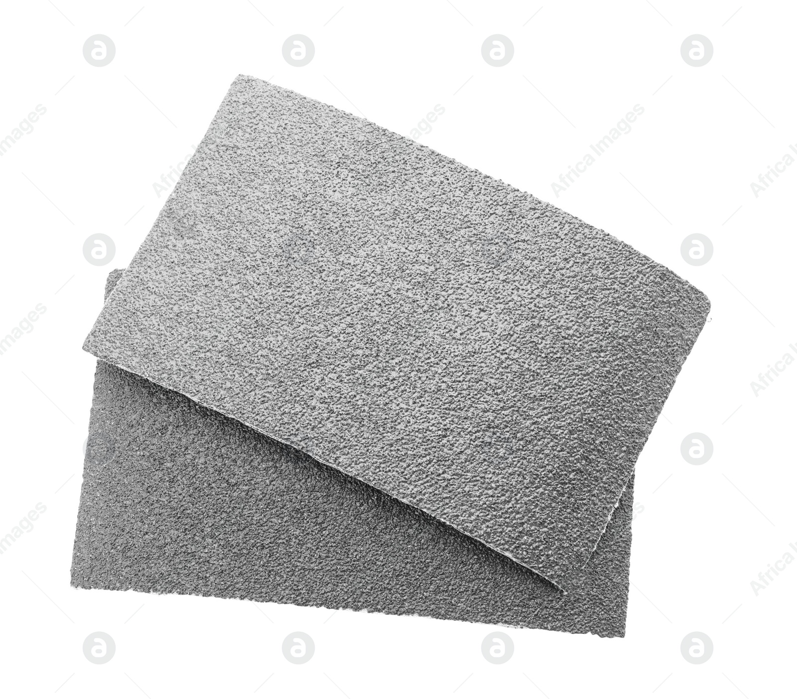 Photo of Two sheets of sandpaper isolated on white, top view