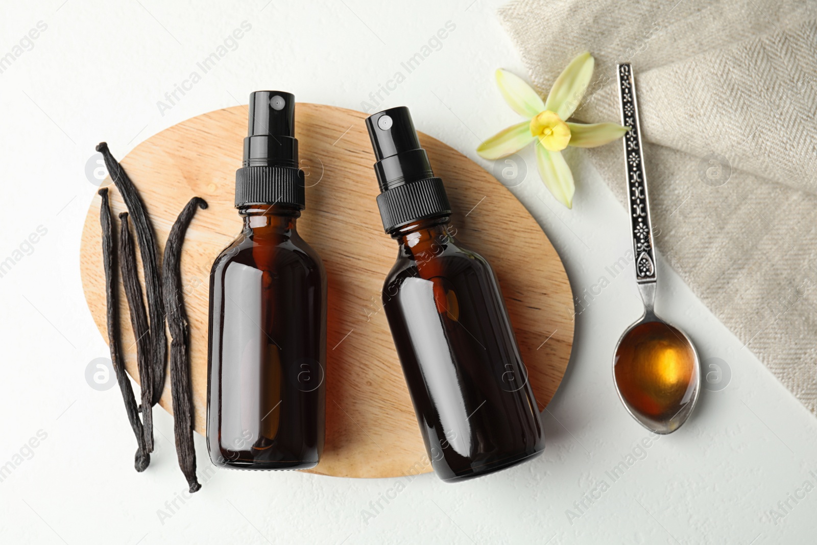 Photo of Flat lay composition with vanilla extract on white table