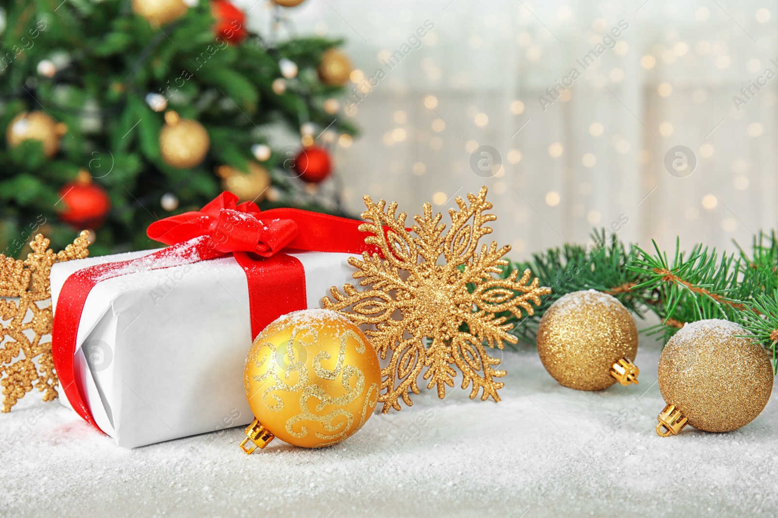 Photo of Beautiful Christmas composition with festive decor and gift box on table