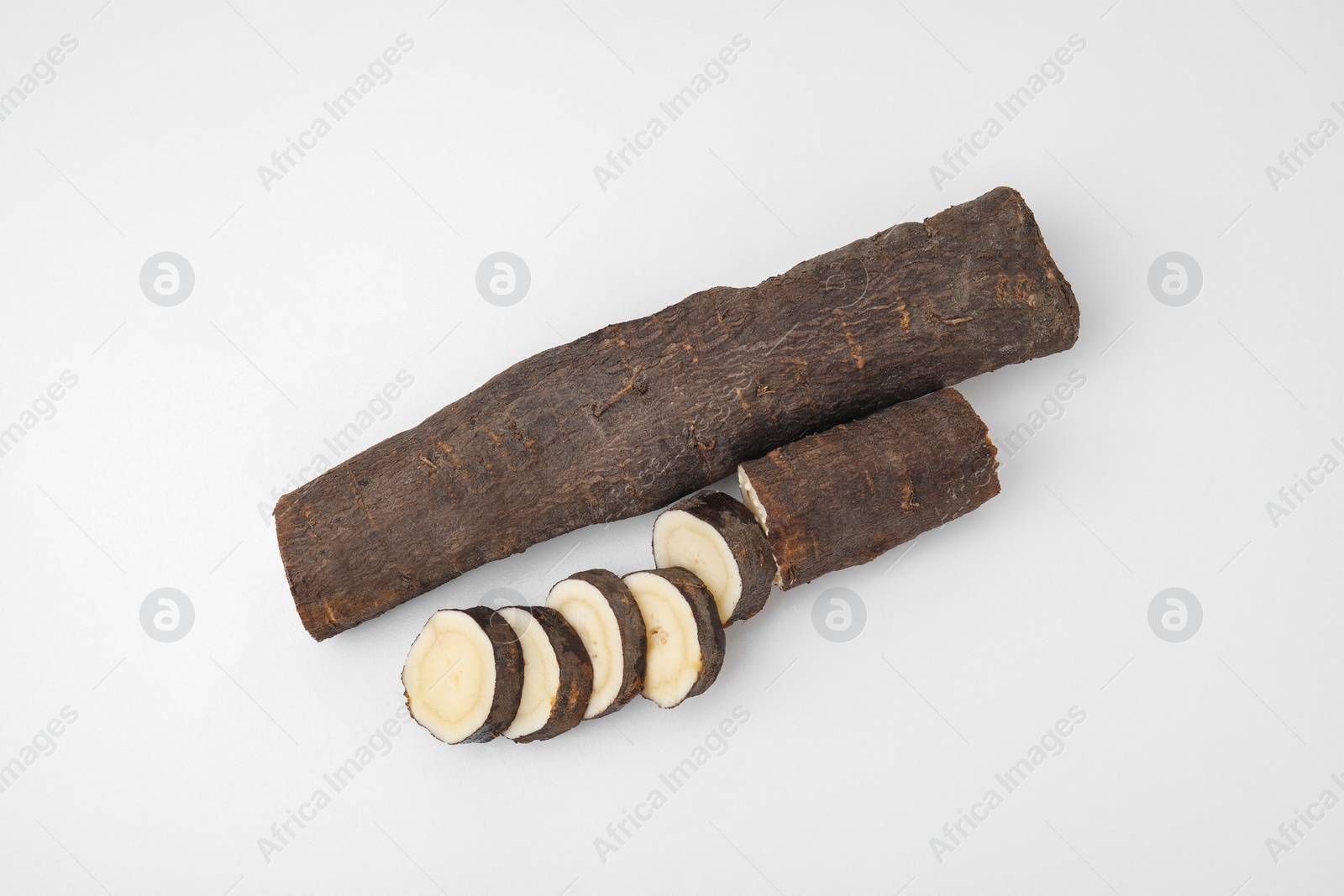 Photo of Cut raw salsify roots on white background, flat lay