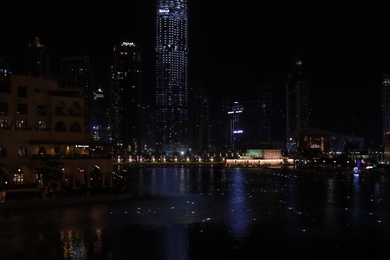 DUBAI, UNITED ARAB EMIRATES - NOVEMBER 04, 2018: Beautiful night cityscape with Burj Khalifa lake at Downtown Dubai