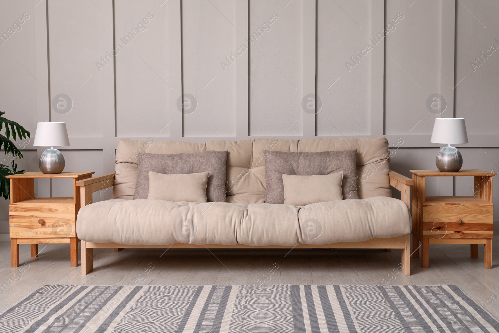 Photo of Living room interior with stylish sofa and lamps