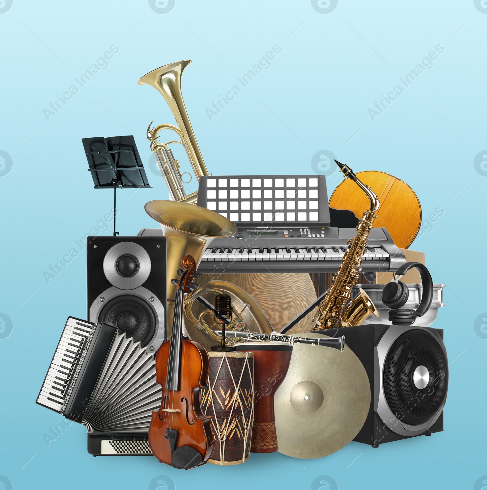 Image of Group of different musical instruments on light blue background