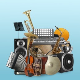 Image of Group of different musical instruments on light blue background