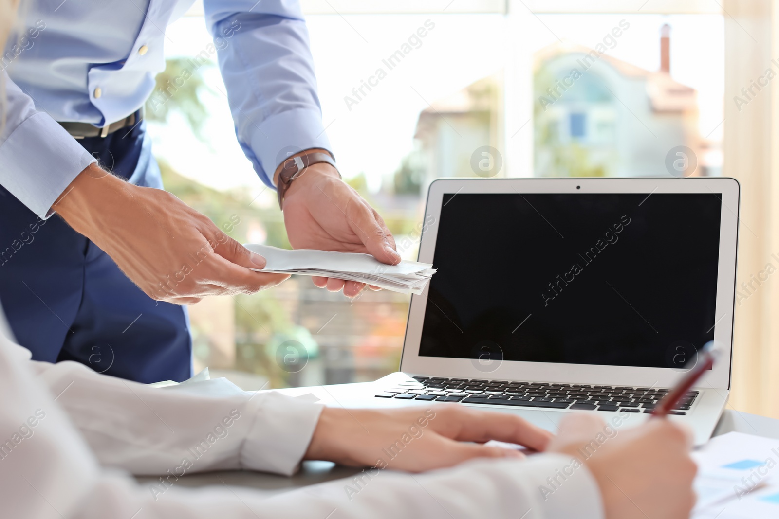 Photo of Tax accountants working with documents at table