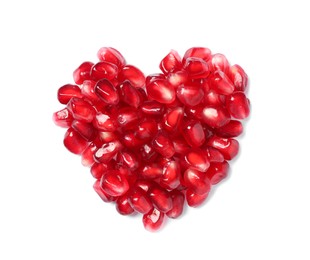 Heart made of tasty pomegranate seeds on white background, top view