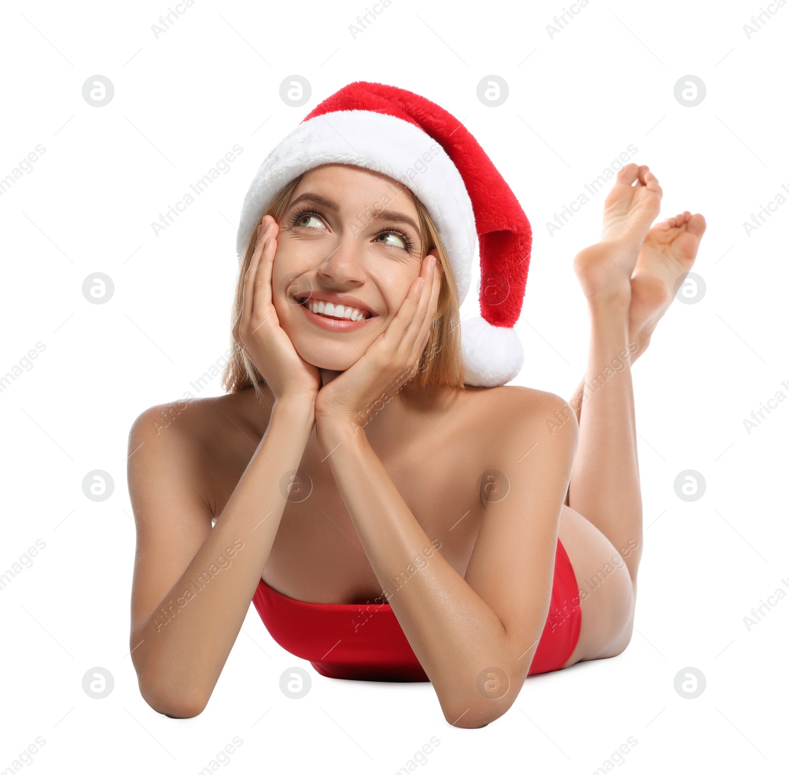 Photo of Young woman wearing Santa Claus hat on white background. Christmas vacation