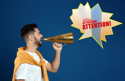 Young man with megaphone on blue background