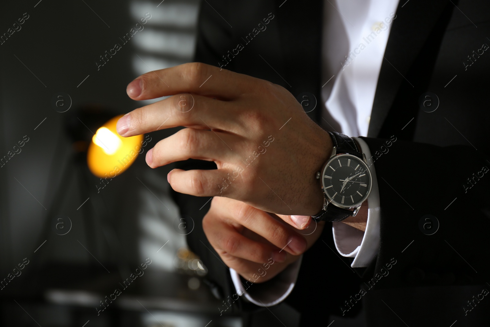 Photo of Businessman with luxury wrist watch indoors, closeup