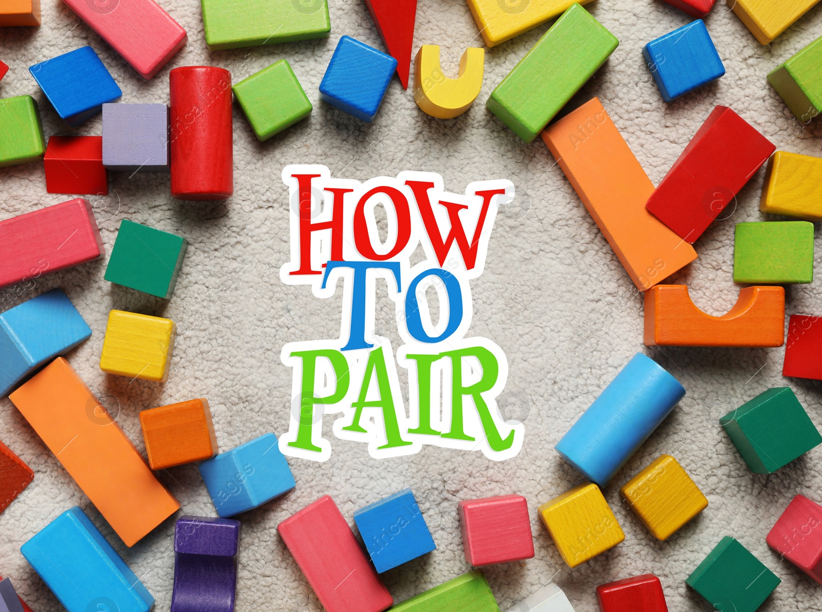 Image of How To Pair. Colorful wooden building blocks on carpet, flat lay