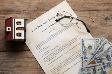 Photo of Last Will and Testament, house model, dollar bills and glasses on wooden table, flat lay