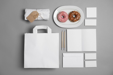 Photo of Flat lay composition with items for mock up design on gray background. Food delivery service