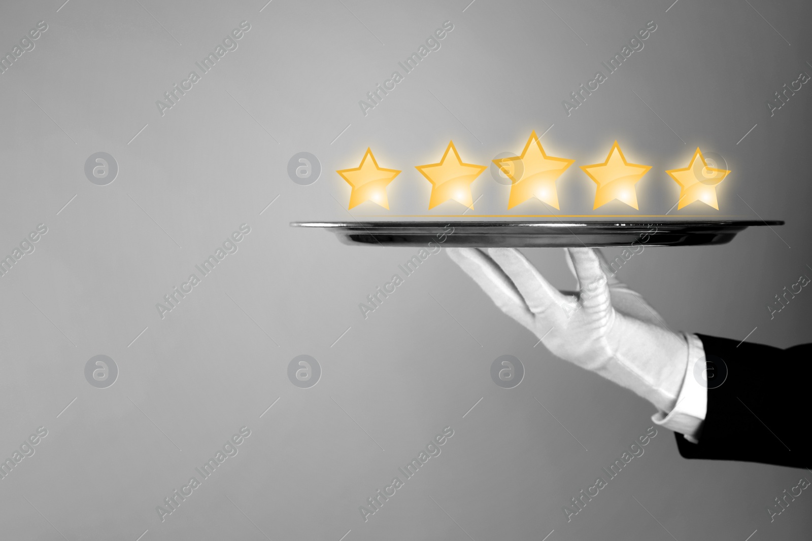 Image of Five Star Luxury Hotel. Waiter with tray on light grey background, closeup