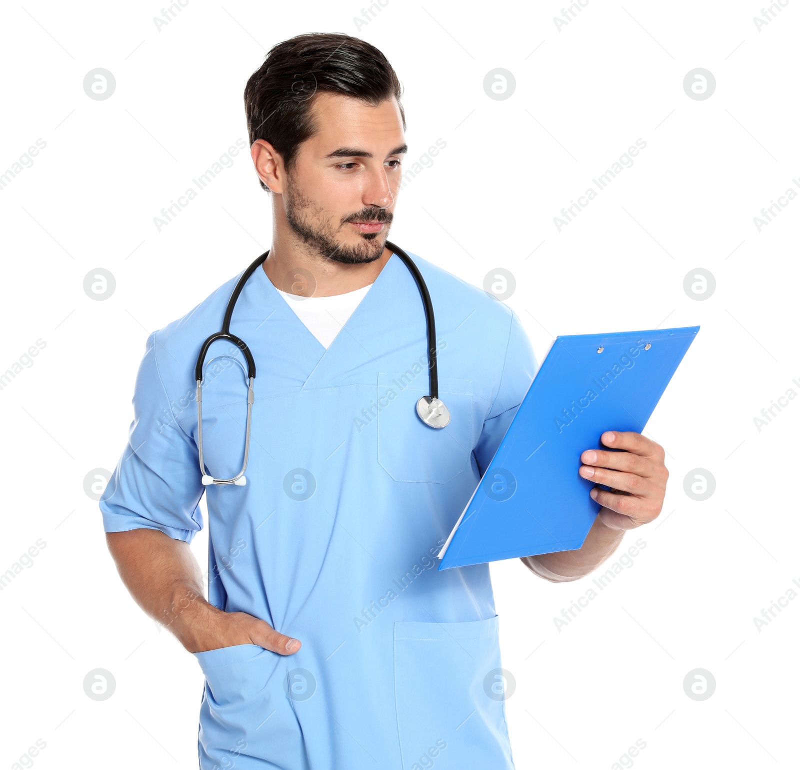 Photo of Young male doctor in uniform with stethoscope and clipboard on white background. Medical service