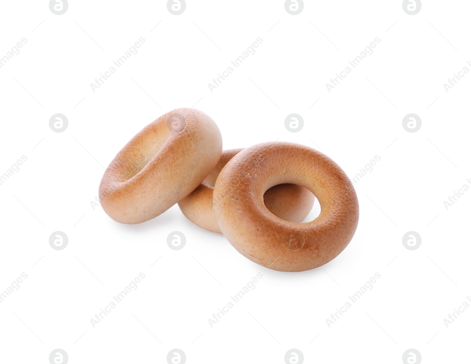 Photo of Tasty dry bagels (sushki) on white background