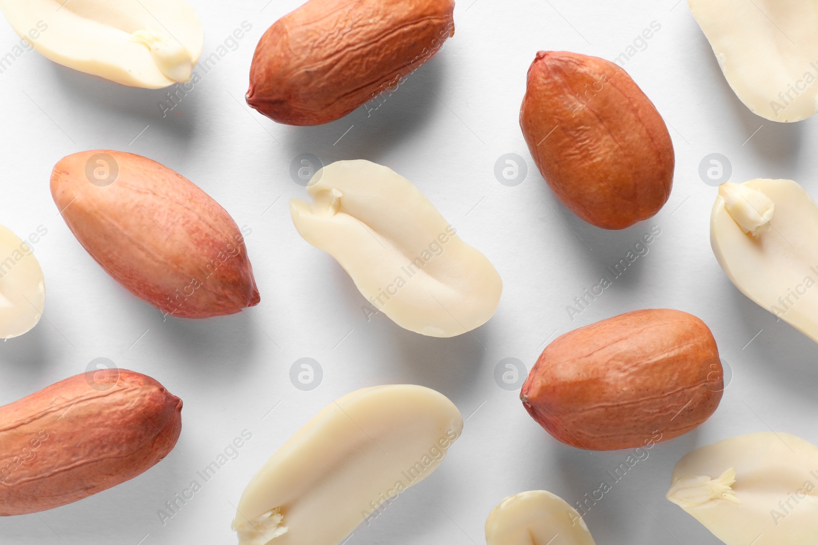 Photo of Fresh peanuts on white background, flat lay