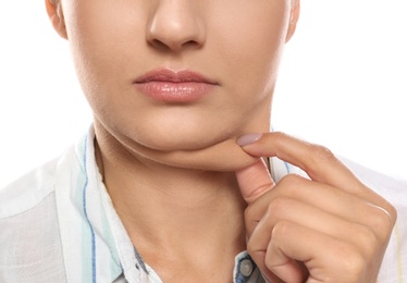 Young woman with double chin on white background, closeup