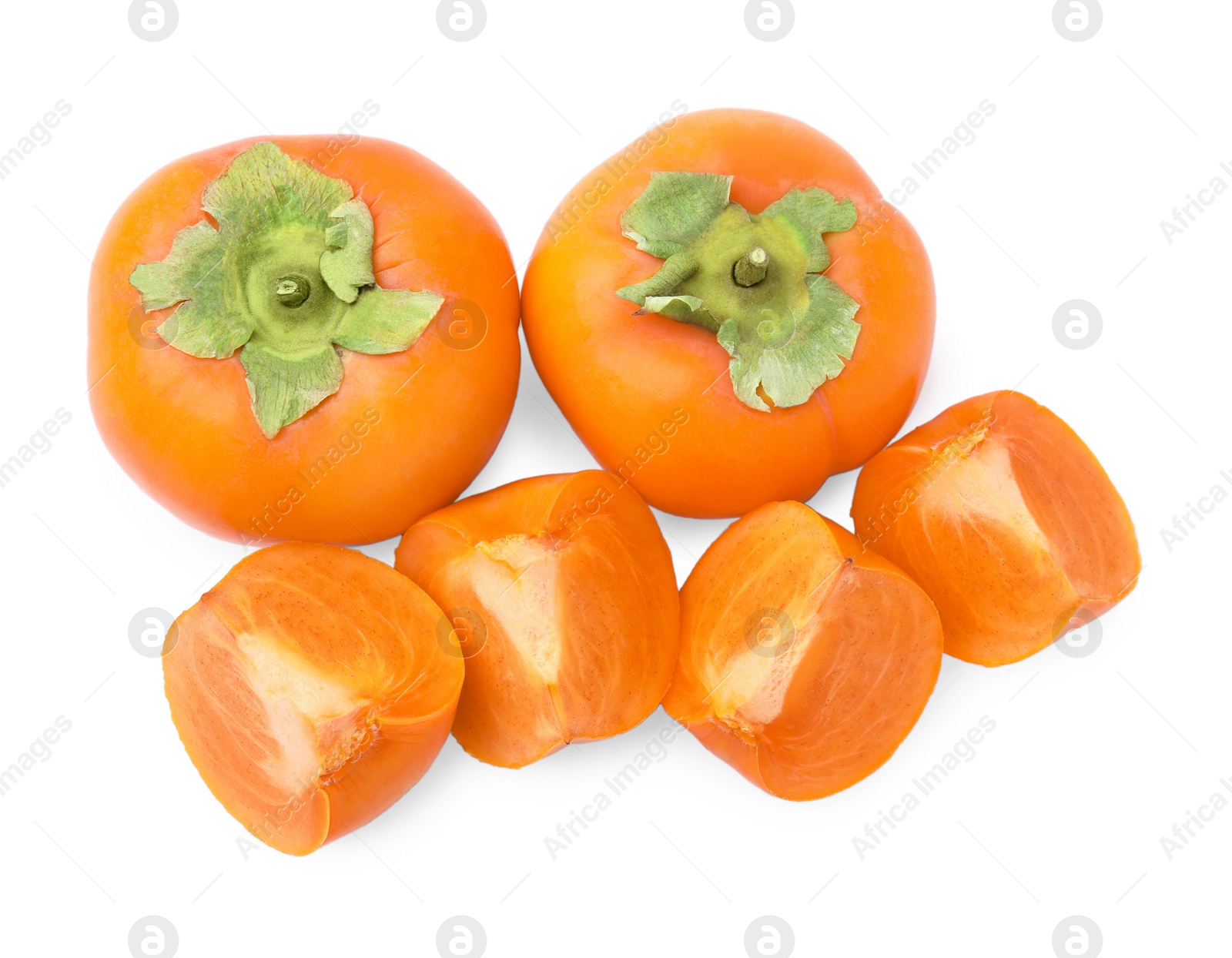 Photo of Whole and cut delicious ripe juicy persimmons on white background, top view