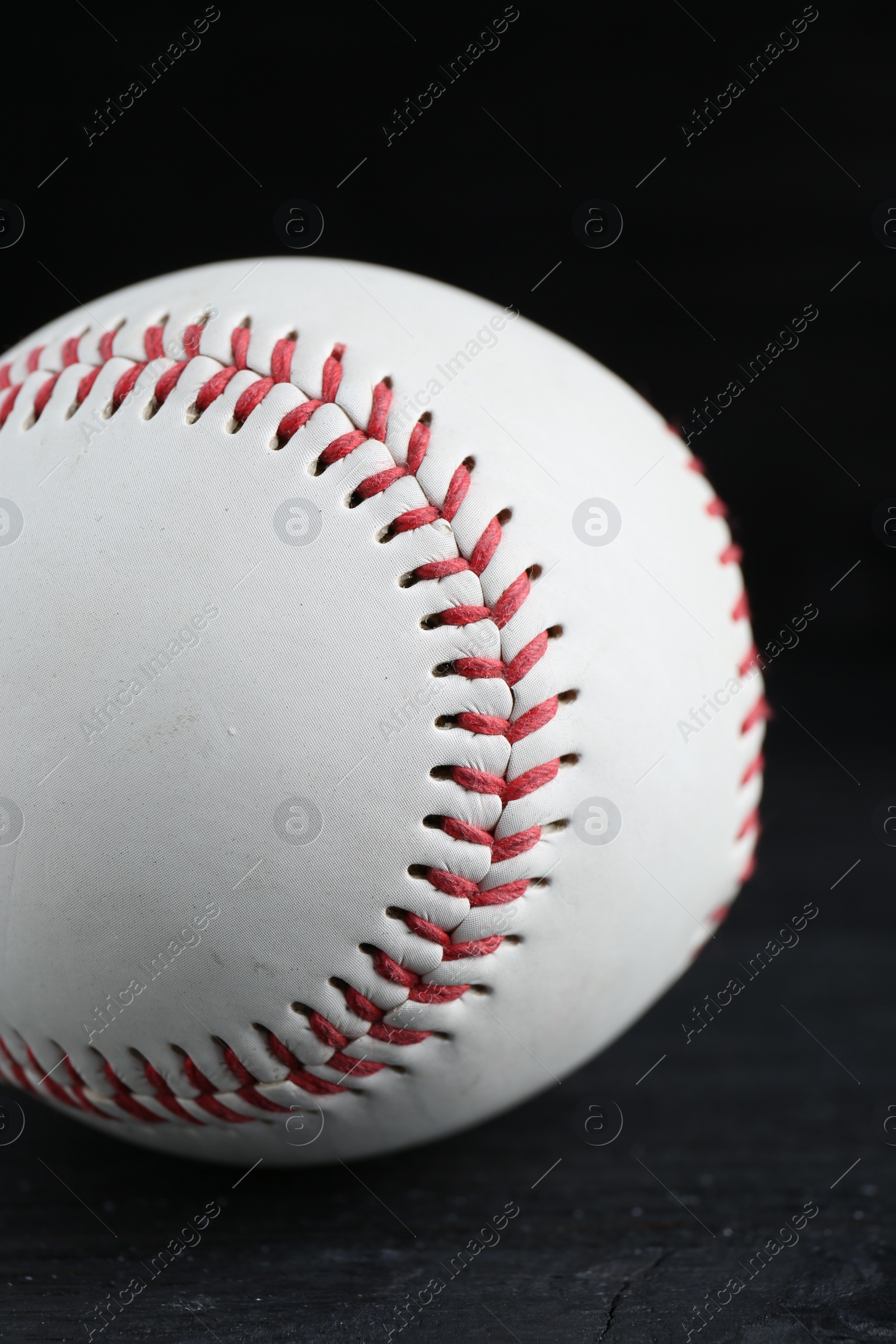 Photo of Baseball ball on black background, closeup. Sports game