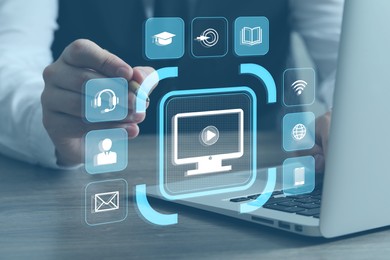 Webinar. Man using virtual screen over laptop at table, closeup