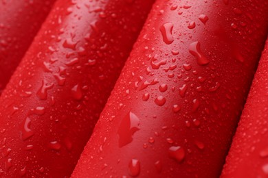 Energy drinks in wet cans as background, closeup