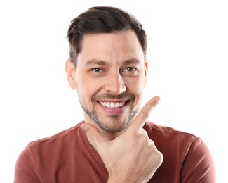 Photo of Smiling man with perfect teeth on white background