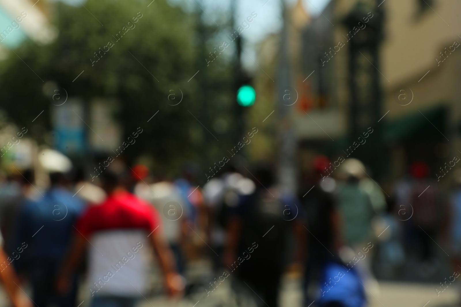 Photo of Blurred view of people on city street