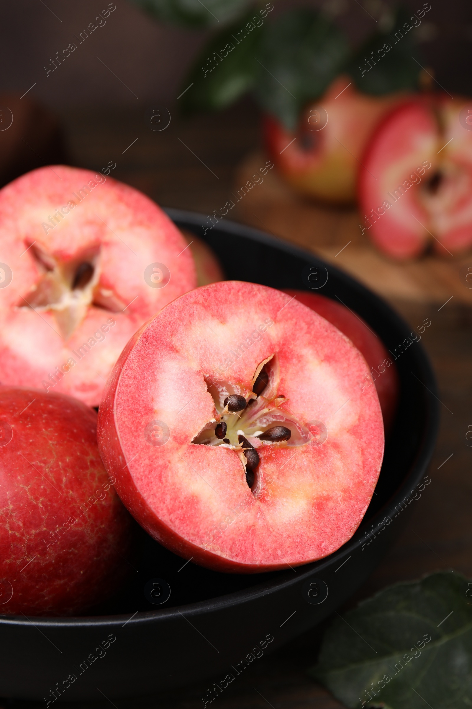 Photo of Tasty apples with red pulp on table, closeup