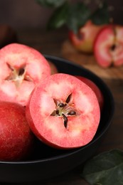 Photo of Tasty apples with red pulp on table, closeup