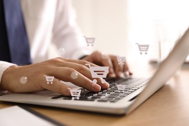 Image of Delivery concept. Man using modern laptop for online shopping indoors, closeup. Market cart illustrations