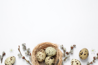 Photo of Flat lay composition with quail eggs on white background, space for text. Easter celebration