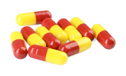 Many antibiotic pills isolated on white. Medicinal treatment